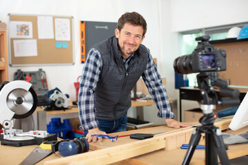 man recording a carpentry blog