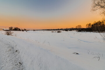 Sunset over a snowy field