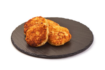 Freshly baked cottage cheese pancakes, isolated on white background.