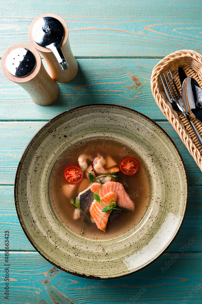 Canvas Prints Trout fish soup in a clay bowl on the table.