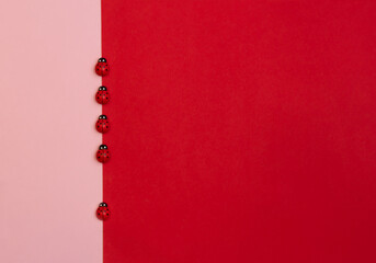 ladybugs on a pink-red background