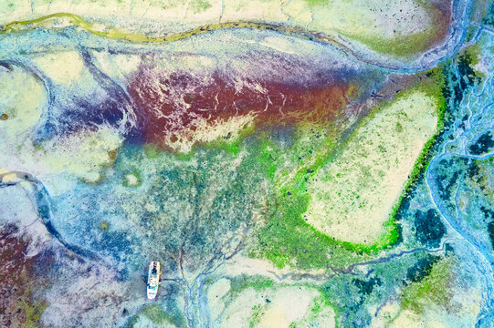 Aerial view of a fishing boat at low tide, Conche du Mimbeau, Lege-Cap-Ferret, Arachon Basin, Gironde, Nouvelle-Aquitaine, France