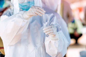 Medical professional doing a COVID antigen test