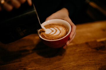 Pouring Latte Art in Red Mug