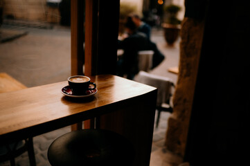 Obraz na płótnie Canvas Latte in a Dark Coffee Shop