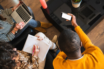 Aerial view of  working group preparing a project in an office.