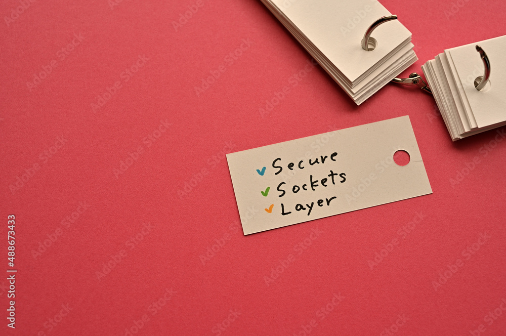 Poster there is a small card placed on a red background paper with the word secure socket layer written on 
