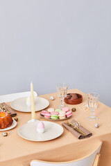 Vertical background image of elegant dinner table decorated for Easter and Spring, copy space