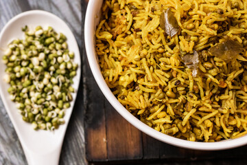 SPROUT RICE INSIDE WHITE SERVING BOWL WITH BLACK BACKGROUND
