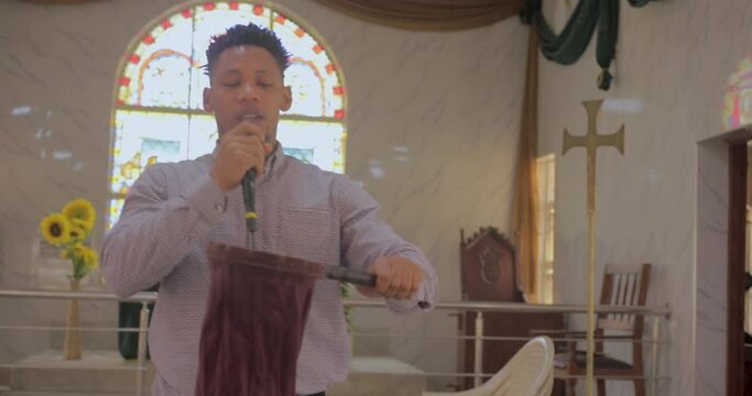pastor blesses tithes and offerings in church