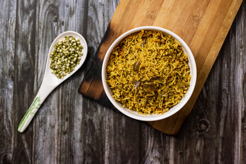 SPROUT RICE INSIDE WHITE SERVING BOWL WITH BLACK BACKGROUND