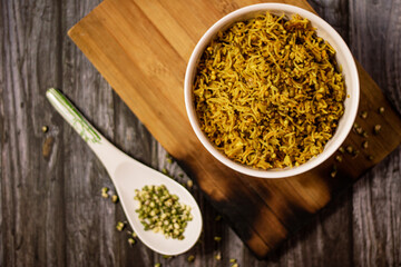 SPROUT RICE INSIDE WHITE SERVING BOWL WITH BLACK BACKGROUND