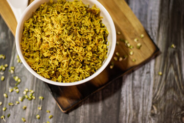 SPROUT RICE INSIDE WHITE SERVING BOWL WITH BLACK BACKGROUND