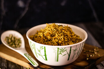 SPROUT RICE INSIDE WHITE SERVING BOWL WITH BLACK BACKGROUND
