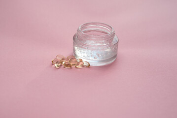 Gel with hyaluronic acid in a glass jar and capsules