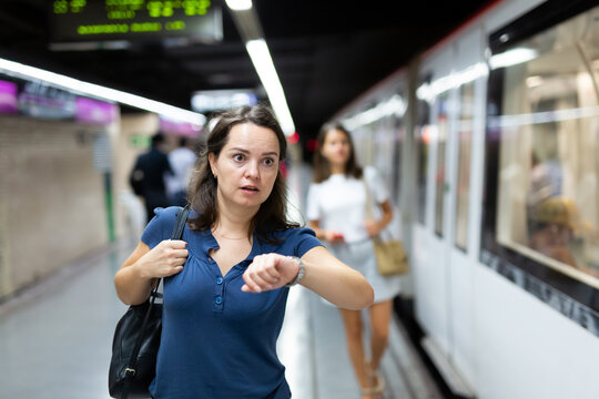 Hurrying woman is late for subway train. High quality photo
