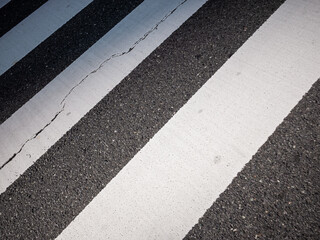 surface of black and white stripe pattern crosswalk in tokyo