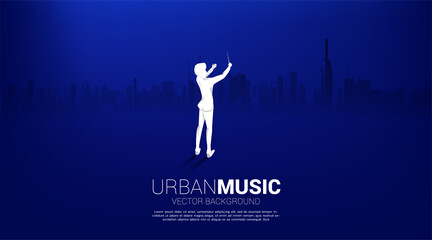 Vector silhouette of conductor standing with city background. Concept for city of music.