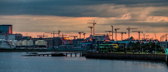 Dublin Harbor Port at sunset with cranes and ships 