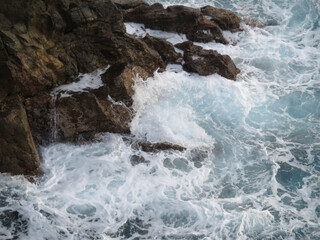 waves crashing on rocks
