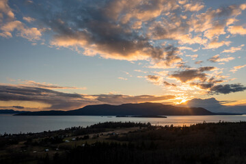 Sunset Over Orcas Island, Washington. Located in the San Juan Islands this drone view and dramatic...