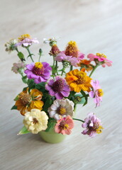 Obraz na płótnie Canvas Bouquet of zinnias, orange, pink, yellow flowers of elegant zinnia , zinnia elegans 