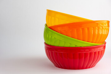 Colored bowls on white background. Concept of kitchen containers.