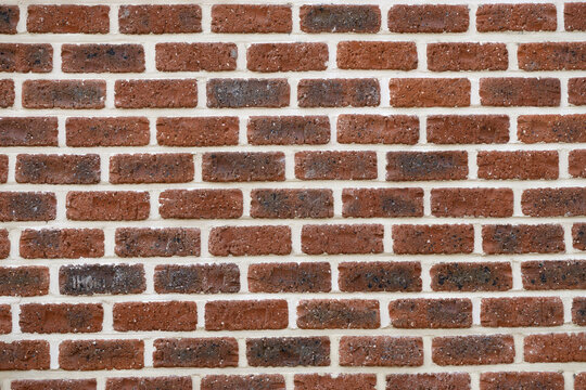 Fototapeta House wall made of dark red brick