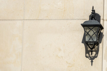 Naklejka premium wall lamp installed on gray marble wall