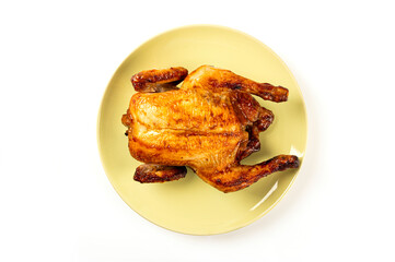 Roasted chicken on a plate isolated on white background. Top view