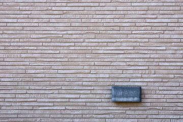 Fototapeta na wymiar wall lamp installed on gray brick wall