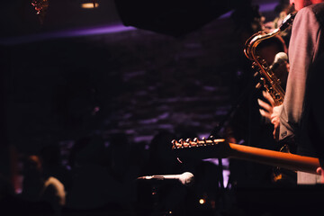 Bassist and trumpet player playing jazz music on stage