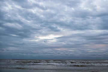 Ocean, beach and storm sky