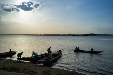 canoes on the banks of the Orinoco river Venezuela at sunset