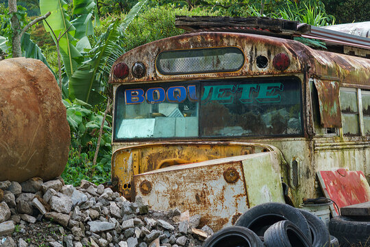 An abandoned schol bus rusts in a junkyard near Boqueue Panama