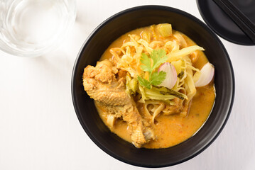 Khao Soi, Northern Thai food noodle red curry soup with coconut milk and chicken
