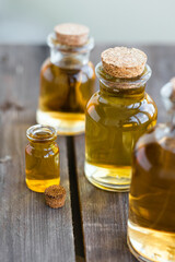 Assortment of organic essential oils. Natural moisturizing body and face treatment. Plant extract for healthy young skin. Relaxation, aromatherapy, salon spa. Close up, macro view