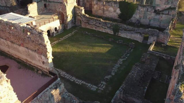 Courtyard ruins of an ancient stone monastery in Moreruela, Zamora, Spain. XII-XIII century buiding of the christian monastic cluny order. Camera getting close.
