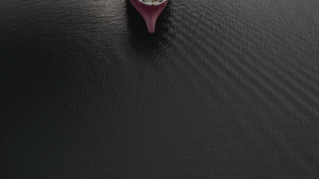 Overhead Fly Over Of A Chemical Oil Tanker Ship On Calm Water On An Overcast Day