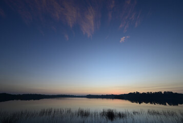 Haze from prescribed burn at sunrise on Nine Mile Pond in Everglades National Park, Florida.