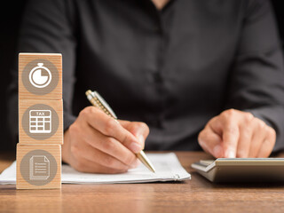 Woman in a black shirt completes the individual income tax payment form