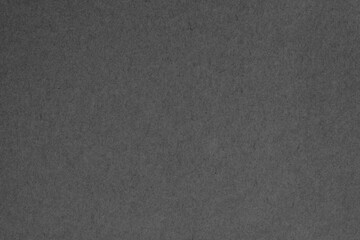 Fototapeta na wymiar Black grey cardboard sheet texture background, pattern of kraft paper with vintage style.
