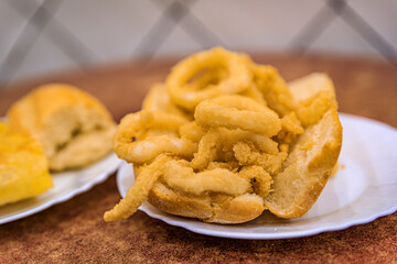 Spanish fried calamari sandwich in a restaurant in Madrid Spain