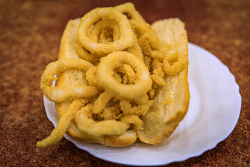 Spanish fried calamari sandwich in a restaurant in Madrid Spain