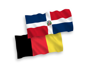National vector fabric wave flags of Dominican Republic and Belgium isolated on white background. 1 to 2 proportion.