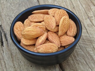 almonds in a black bowl