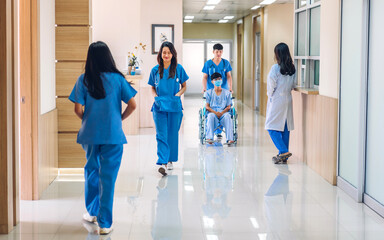 Group of professional medical doctor team work with stethoscope in uniform  working discussing and talk with sick patient walking in hospital.health medical care concept