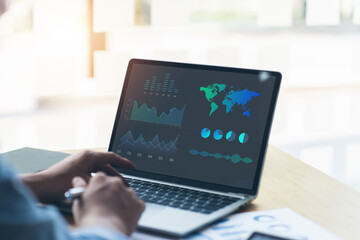 Technology in Finance and Business Marketing Concept. Graphs and Charts show on Computer's Screen....