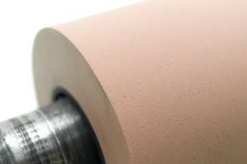 Anilox roller for flexographic printing machine. Raster cylinder for transferring ink to the printing roller. Selective focus, isolated on white