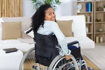 portrait of a happy young woman in a wheelchair